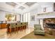 Entertainment room with bar seating, columns, coffered ceiling and stone fireplace at 4465 E Paradise Village S Pkwy # 1179, Phoenix, AZ 85032