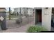 Apartment entrance featuring a gated walkway and view of the building's architecture at 4465 E Paradise Village S Pkwy # 1179, Phoenix, AZ 85032