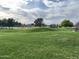 Scenic view of Stonecreek Golf Course featuring lush green fairways and mature trees at 4465 E Paradise Village S Pkwy # 1179, Phoenix, AZ 85032