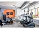 Well-equipped gym with modern treadmills, elliptical machines, and a bright accent wall at 4465 E Paradise Village S Pkwy # 1179, Phoenix, AZ 85032