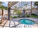 Relaxing hot tub area with comfortable seating and views of the community pool and lush greenery at 4465 E Paradise Village S Pkwy # 1179, Phoenix, AZ 85032
