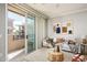 Bright living room featuring a sliding glass door to the balcony, allowing for plenty of natural light at 4465 E Paradise Village S Pkwy # 1179, Phoenix, AZ 85032