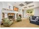 Spacious living room with fireplace, TV, coffered ceiling and large window at 4465 E Paradise Village S Pkwy # 1179, Phoenix, AZ 85032