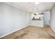 Bright living room with a ceiling fan and adjacent kitchen bar with pendant lights at 4465 E Paradise Village S Pkwy # 1179, Phoenix, AZ 85032