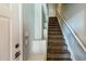 Carpeted staircase with neutral walls and trim, leading to the upper level of the home at 4465 E Paradise Village S Pkwy # 1179, Phoenix, AZ 85032