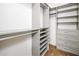 Organized walk-in closet boasts adjustable shelving and drawers for efficient storage at 4465 E Paradise Village S Pkwy # 1179, Phoenix, AZ 85032