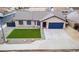 Single-story home featuring a square of manicured lawn, ample parking, and boat parking at 502 N 110Th St, Mesa, AZ 85207