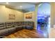 Comfortable living room featuring a large sectional sofa and elegant hardwood floors at 502 N 110Th St, Mesa, AZ 85207