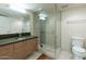 Modern bathroom with a glass shower, tiled floors, and a sleek vanity, offering a spa-like experience at 535 W Thomas Rd # 211, Phoenix, AZ 85013