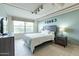 Cozy bedroom with tile floors, a large window, and stylish decor at 535 W Thomas Rd # 211, Phoenix, AZ 85013