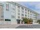 Stylish building with a modern design, lush landscaping, and street-level access in an urban setting at 535 W Thomas Rd # 211, Phoenix, AZ 85013