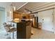 Open-concept kitchen with bar seating, modern cabinets, and stainless steel appliances, perfect for entertaining guests at 535 W Thomas Rd # 211, Phoenix, AZ 85013