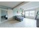 Bright living room features tile flooring, large window, and comfortable gray couch at 535 W Thomas Rd # 211, Phoenix, AZ 85013