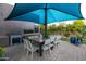 Outdoor dining area with a stainless steel grill and a large table with seating for ten at 59 W Cypress St, Phoenix, AZ 85003