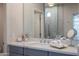 Bathroom boasts a marble countertop, contemporary fixtures, and a large mirror at 59 W Cypress St, Phoenix, AZ 85003
