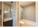 Modern bathroom with sleek vanity, bathtub with glass enclosure, and contemporary fixtures at 59 W Cypress St, Phoenix, AZ 85003