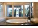 Bathroom showcasing a soaking tub, garden views, stylish fixtures, and designer accents at 59 W Cypress St, Phoenix, AZ 85003