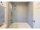 Contemporary bathroom featuring a bathtub with glass surround and stylish fixtures at 59 W Cypress St, Phoenix, AZ 85003