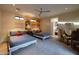 Bright bedroom featuring two beds, colorful wall decor, and a sitting area at 59 W Cypress St, Phoenix, AZ 85003