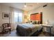 Bedroom with a comfortable bed, window, side tables, and neutral tones at 59 W Cypress St, Phoenix, AZ 85003