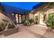 Charming courtyard featuring brick pavers, lush landscaping, and access to the home's interior at 59 W Cypress St, Phoenix, AZ 85003
