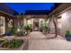 Stunning private courtyard with lush greenery, tiled flooring, and access to living spaces at 59 W Cypress St, Phoenix, AZ 85003