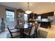 Open-concept dining room with a view to the kitchen with stainless steel appliances at 59 W Cypress St, Phoenix, AZ 85003