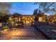 Welcoming desert home with beautiful landscaping, warm lighting, and inviting front walkway at 59 W Cypress St, Phoenix, AZ 85003