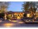 Charming home with desert landscaping, decorative cacti, and inviting pathway at twilight at 59 W Cypress St, Phoenix, AZ 85003