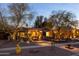 Inviting home showcasing desert landscaping, warm lighting, and charming curb appeal in twilight at 59 W Cypress St, Phoenix, AZ 85003