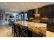 Spacious kitchen with a large island, dark wood cabinetry, and stainless steel appliances at 59 W Cypress St, Phoenix, AZ 85003