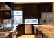 Open concept kitchen with a stainless steel refrigerator and view of backyard at 59 W Cypress St, Phoenix, AZ 85003