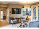 Bright living room featuring cozy seating, a large TV, and an inviting atmosphere at 59 W Cypress St, Phoenix, AZ 85003