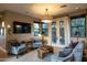 Inviting living room with neutral tones, comfortable seating, and French doors to outdoor space at 59 W Cypress St, Phoenix, AZ 85003