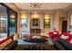 Bright living room featuring a modern chandelier, comfortable seating, and sophisticated decor at 59 W Cypress St, Phoenix, AZ 85003