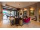 Elegant living area with travertine floors, luxurious furnishings, and seamless indoor-outdoor flow at 59 W Cypress St, Phoenix, AZ 85003