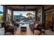 Covered patio with comfortable seating overlooking the pool and lush landscaping at 59 W Cypress St, Phoenix, AZ 85003