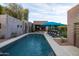 Beautiful backyard pool with lounge chairs, landscaping and exterior architectural design at 59 W Cypress St, Phoenix, AZ 85003