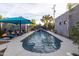 Inviting backyard pool area with comfortable lounge chairs and a tranquil, modern design at 59 W Cypress St, Phoenix, AZ 85003