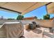 A covered back patio with two grills and plenty of space for outdoor furniture at 6319 E Duncan St, Mesa, AZ 85205