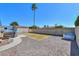 Back yard with a hot tub, shed, and patio; the lawn is surrounded by gravel at 6319 E Duncan St, Mesa, AZ 85205
