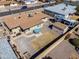 Aerial view of backyard with patio area, hot tub, shed, RV and an additional outbuilding at 6319 E Duncan St, Mesa, AZ 85205