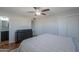 Main bedroom with neutral walls, ceiling fan, and access to an ensuite bathroom at 6319 E Duncan St, Mesa, AZ 85205