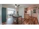 The dining room showcases hardwood floors, a table with seating, and seamless flow to kitchen at 6319 E Duncan St, Mesa, AZ 85205