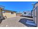 Gravel driveway features an RV and shed next to the house with blue trim and rock landscaping at 6319 E Duncan St, Mesa, AZ 85205