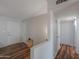 Hallway with warm wood floors and bright white trim at 6319 E Duncan St, Mesa, AZ 85205