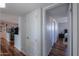 Well-lit hallway showcasing wood floors and easy access to other areas at 6319 E Duncan St, Mesa, AZ 85205