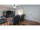 Cozy living room with hardwood floors, a fireplace, and ample natural light at 6319 E Duncan St, Mesa, AZ 85205
