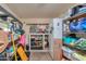 Storage room with shelving and extra refrigerator; this is a great space at 6319 E Duncan St, Mesa, AZ 85205