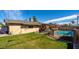 Backyard view showcasing an in-ground pool, patio area, and well-maintained lawn at 8519 E Rancho Vista Dr, Scottsdale, AZ 85251